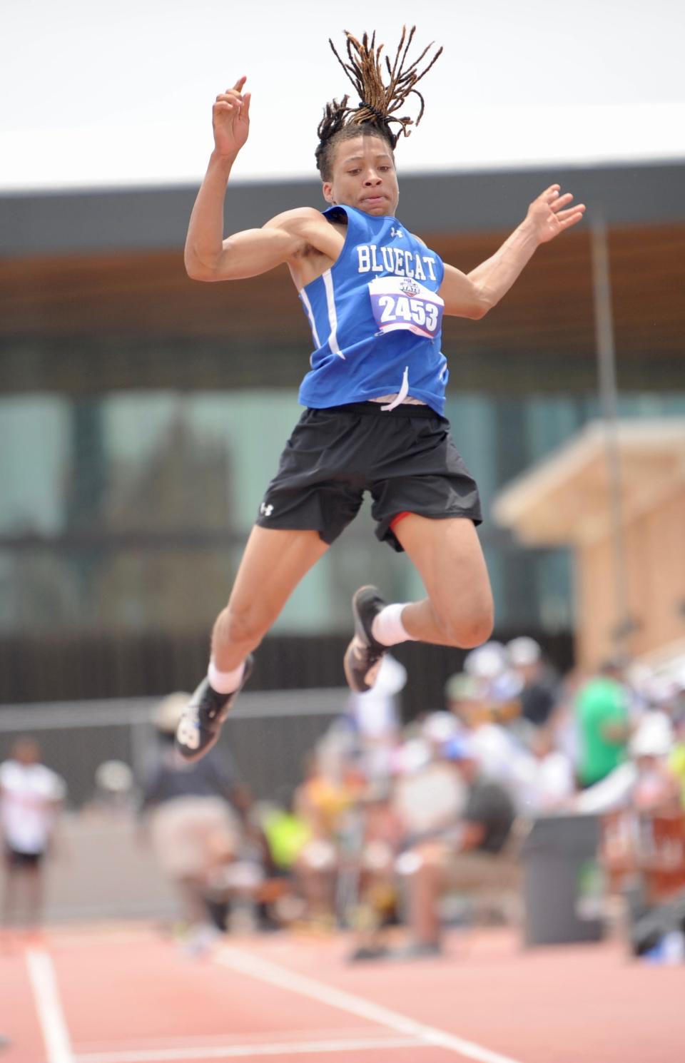 Coleman's Devinar Roberson competes in the triple jump at the state track and field meet in Austin.