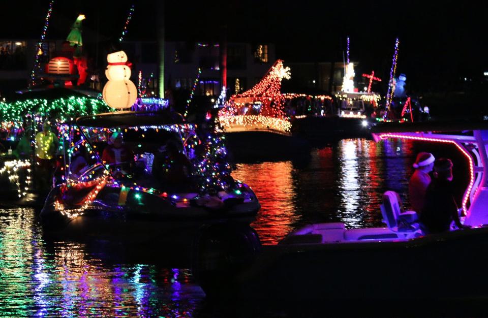 Participants in the Cape Coral Holiday Boat-A-Long cruise Bimini Basin in their boats on Saturday, Dec. 18, 2021, in Cape Coral.