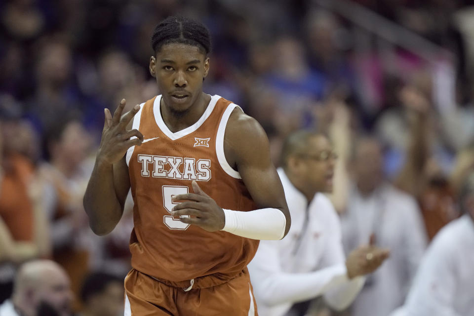 Texas guard Marcus Carr celebrates after making a basket during the second half of the NCAA college basketball championship game against Kansas in the Big 12 Conference tournament Saturday, March 11, 2023, in Kansas City, Mo. (AP Photo/Charlie Riedel)