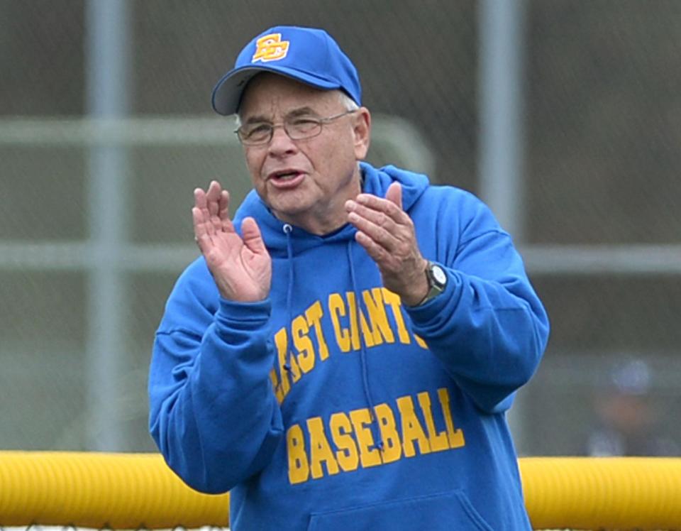 East Canton baseball coach Doug Miller encourages his team during a 2019 game.