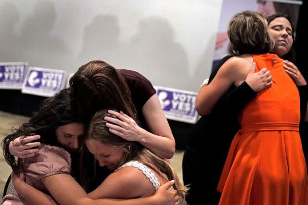 PHOTO: People hug during a Value Them Both watch party after a ballot initiative involving a constitutional amendment removing abortion protections from the Kansas constitution failed, Aug. 2, 2022, in Overland Park, Kan. (Charlie Riedel/AP)