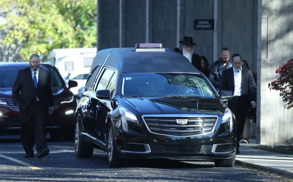 The hearse caring the body of Samantha Woll leaves the Hebrew Memorial Chapel Sunday, Oct 22, 2023. Wolf 40, was found stabbed to death near her Lafayette Park home Saturday.