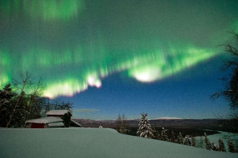 In this March 8, 2012 photo, the colorful northern lights are seen from Ruby, Alaska. Mitch Seavey is the first musher in the Iditarod Trail Sled Dog Race to reach the village of Ruby, on Friday, March 9, 2012, 480 miles from the finish line at Nome.  (AP Photo/Anchorage Daily News, Marc Lester)