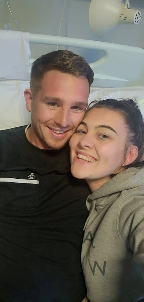 Daniel Turner recovers from his ordeal in hospital, pictured with his partner Elishia Paxton. (SWNS)