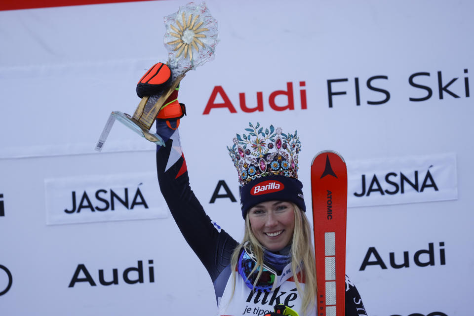 United States' Mikaela Shiffrin celebrates on the podium after winning an alpine ski, women's World Cup slalom race, in Jasna, Slovakia, Sunday, Jan. 21, 2024. (AP Photo/Giovanni Maria Pizzato)