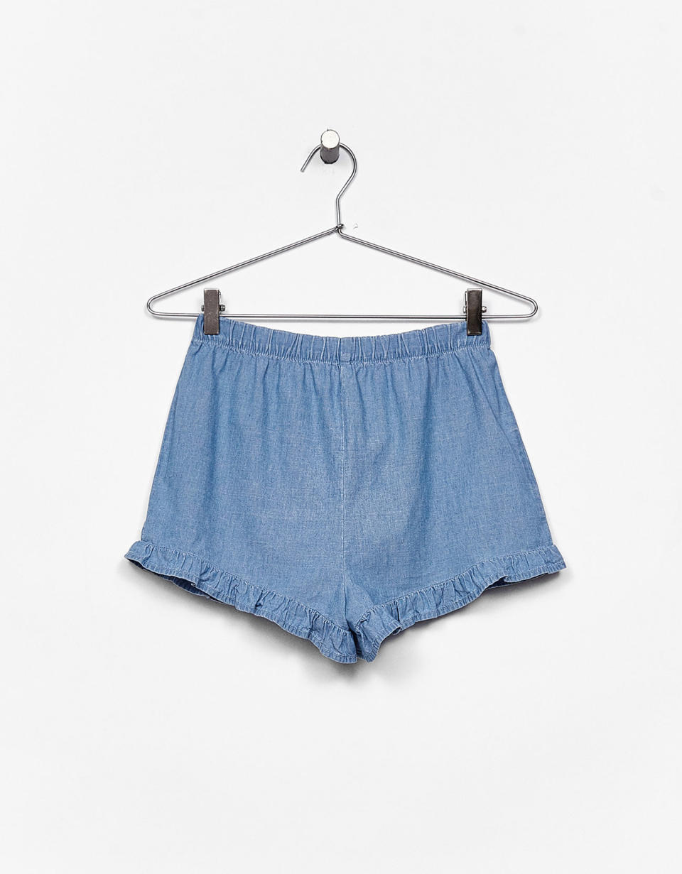 <p>Thin denim shorts with frills, £9.99, <a rel="nofollow noopener" href="https://www.bershka.com/gb/woman/clothes/new/thin-denim-shorts-with-frills-c1010195501p101018006.html?colorId=428" target="_blank" data-ylk="slk:Bershka;elm:context_link;itc:0;sec:content-canvas" class="link ">Bershka</a></p>