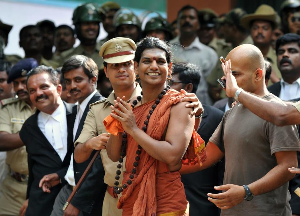 <div class="inline-image__title">146317375</div> <div class="inline-image__caption"><p>Police escort controversial Hindu Godman Swami Nityananda after his bail plea in 2012. </p></div> <div class="inline-image__credit">Manjunath Kiran/AFP/Getty</div>