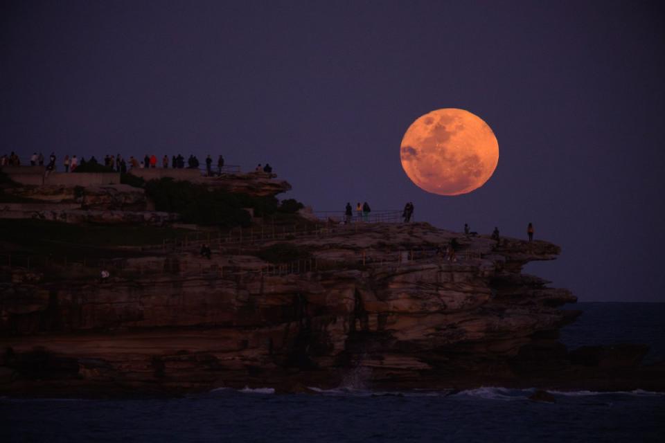 The super blue moon appears in the night sky over Ben Buckler cliffs at Bondi Beach, Sydney, on Aug. 31, 2023.<span class="copyright">Dan Himbrechts—AAPIMAGE/Reuters</span>
