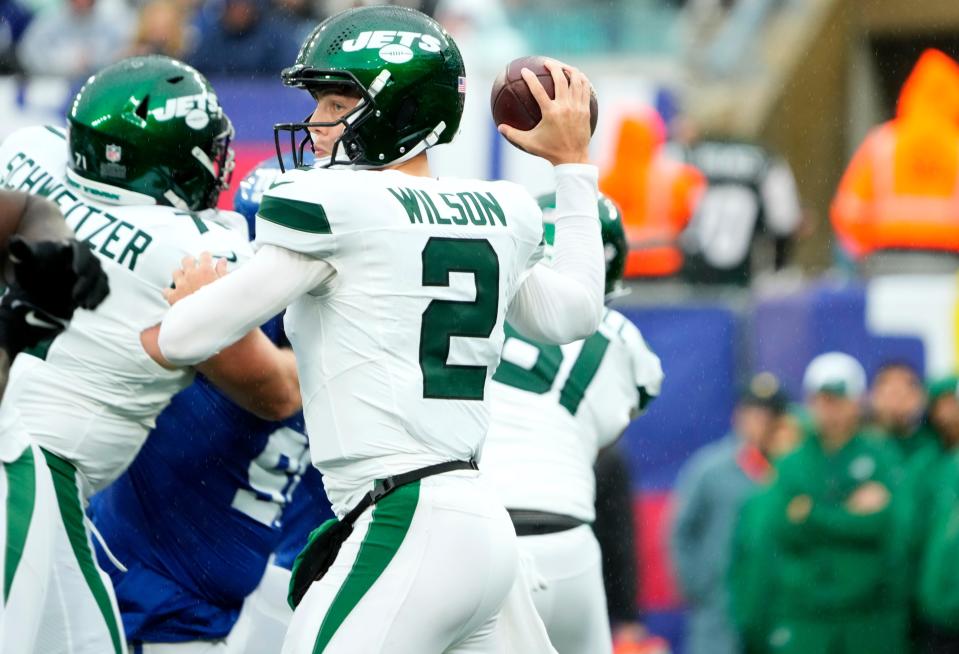 October 29, 2023; East Rutherford, NJ, USA; New York Jets quarterback Zach Wilson (2) is shown as he looks for an open teammate during the first half.