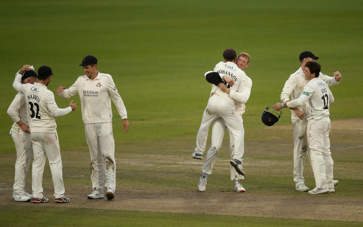 Lancashire players celebrate the win and promotion during day 3 of the Specsavers County Championship: Division Two match between Lancashire and Derbyshire at Emirates Old Trafford on September 12, 2019 in Manchester, England - Getty Images