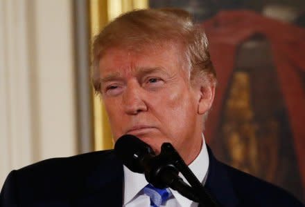 U.S. President Donald Trump hosts a Public Safety Medal of Valor awards ceremony in the East Room of the White House in Washington, U.S., February 20, 2018. REUTERS/Leah Millis