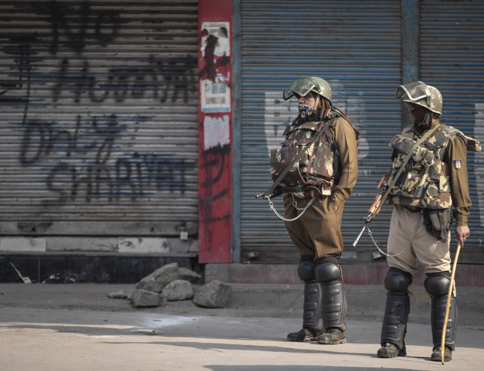 Indian paramilitary soldiers stand guard at a closed market area during a strike called by separatists in Srinagar, Indian controlled Kashmir, Saturday, Oct. 31, 2020. Kashmir’s main separatist grouping called the strike to protest new land laws that India enacted on Tuesday, allowing any of its nationals to buy land in the region. Pro-India politicians in Kashmir have also criticized the laws and accused India of putting Kashmir’s land up for sale. The move exacerbates concerns of Kashmiris and rights groups who see such measures as a settler-colonial project to change the Muslim-majority region’s demography. (AP Photo/Mukhtar Khan)