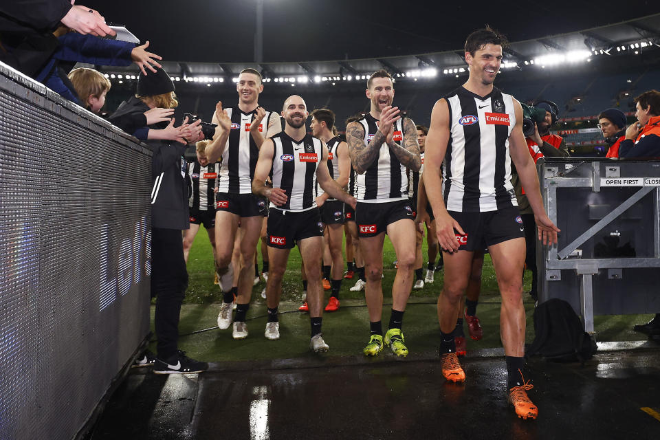 Collingwood players, pictured here celebrating after their win over GWS.