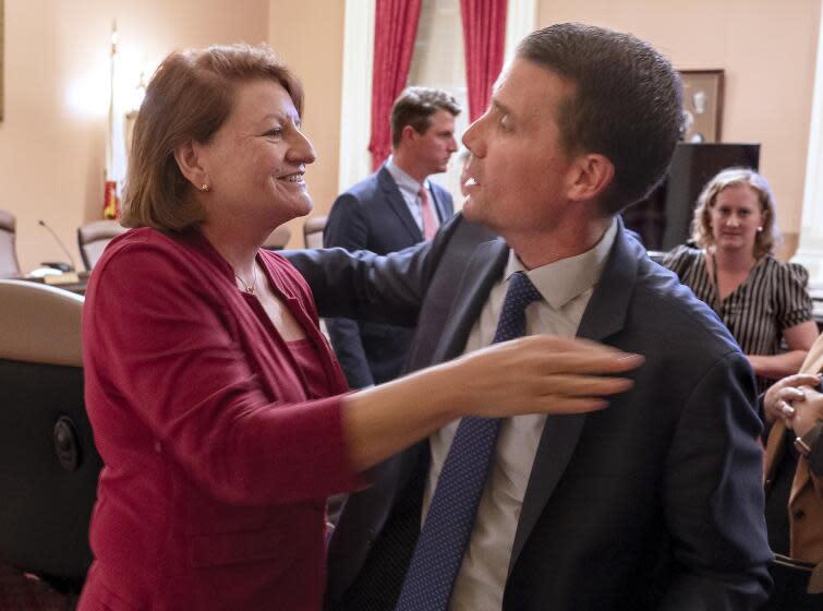 California state Senate President Toni Atkins, of San Diego, left, hugs Sen. Mike McGuire, D-Healdsburg, after he was named the successor to Atkins at the Capitol in Sacramento, Calif., Monday, Aug. 28, 2023. Atkins said McGuire will take over as Senate Leader sometime next year. (AP Photo/Rich Pedroncelli)