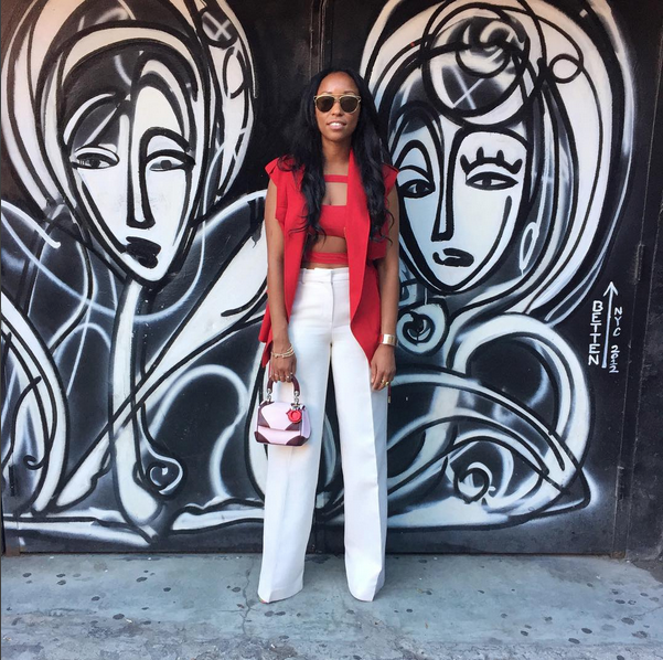<p>You know you’re a style star when you can wear a swimsuit to work. Turini paired an Acne Studios red bathing suit top with Dior pants, a red blazer-vest, and a light pink mini bag by Dior. J’adore! </p>