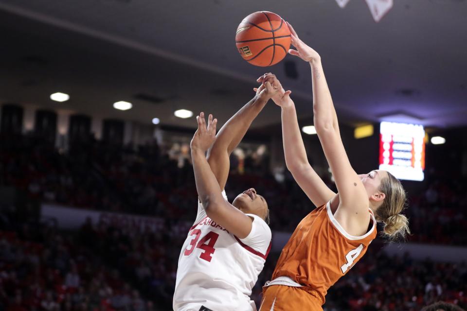 Texas forward Taylor Jones blocks the shot of Oklahoma forward Liz Scott during Saturday's UT win. The Longhorns don't have much time to celebrate; they lead the Big 12 by one game with two to go, but the first of those games is Monday at home against Baylor.