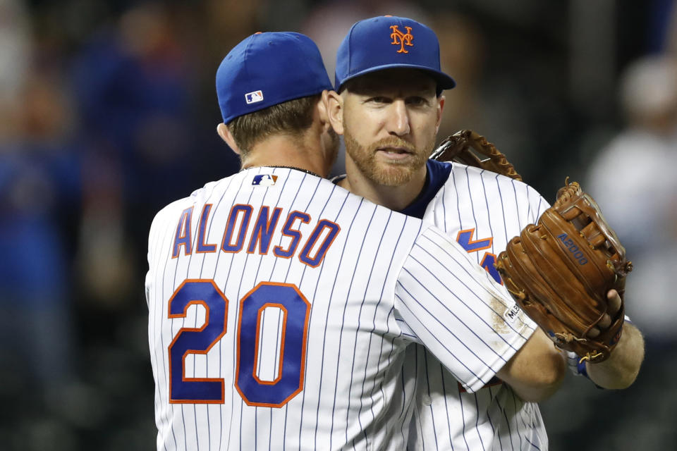 New York Mets first baseman Pete Alonso (20) embraces third baseman Todd Frazier after the Mets' 10-3 victory over the Miami Marlins in a baseball game Wednesday, Sept. 25, 2019, in New York. (AP Photo/Kathy Willens)