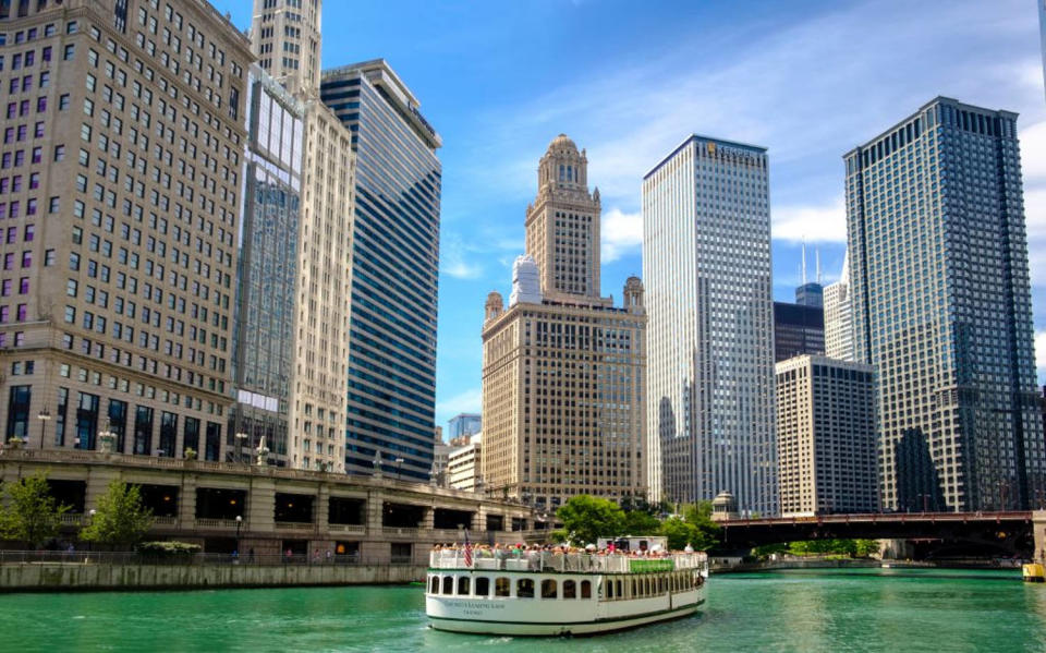 Chicago River and River Cruise with surrounding downtown architecture in summer, Chicago, Illinois (Jumping Rocks / Universal Images Group via Getty)