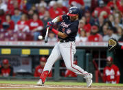 Washington Nationals' Luis García hits an RBI-single against Cincinnati Reds pitcher Vladimir Gutierrez during the first inning of a baseball game in Cincinnati, Saturday, Sept. 25, 2021. (AP Photo/Paul Vernon)