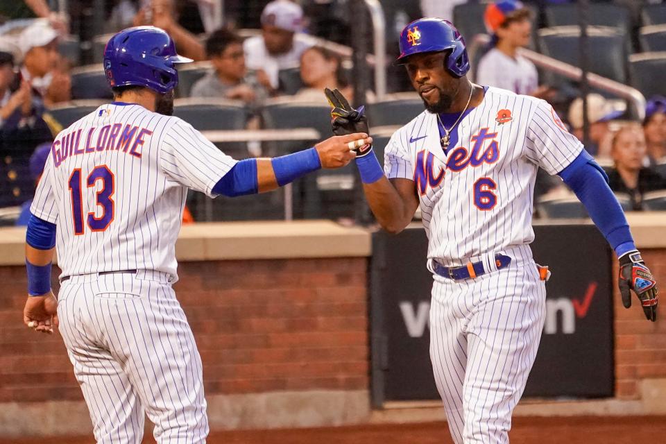 New York Mets' Starling Marte (6) and Luis Guillorme (13) celebrate after scoring off Marte's two-run home run during the second inning of a baseball game against the Washington Nationals, Monday, May 30, 2022, in New York. (AP Photo/Mary Altaffer)