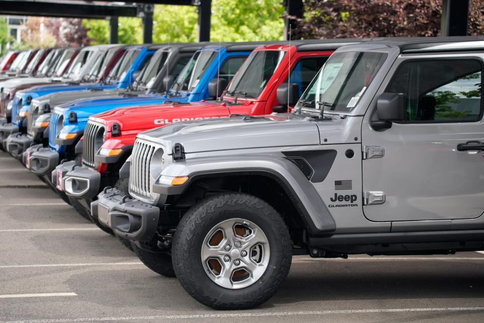 Jeep Gladiator pickup trucks at a dealership.