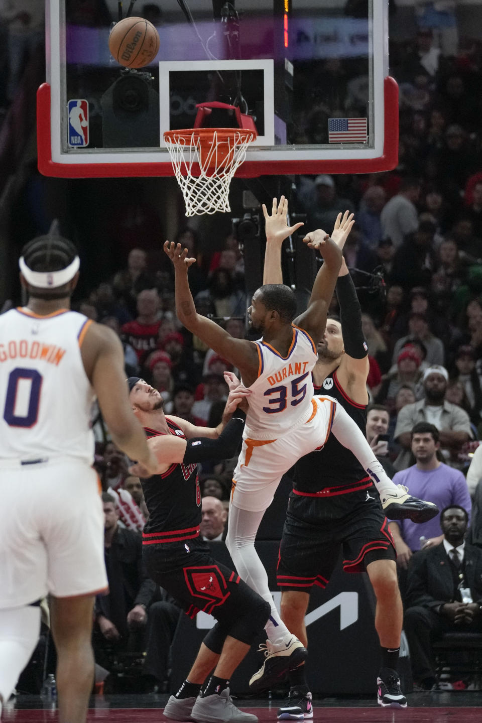 Phoenix Suns forward Kevin Durant (35) gets fouled by Chicago Bulls center Nikola Vucevic during the overtime of an NBA basketball game, Wednesday, Nov. 8, 2023, in Chicago. Phoenix won 116-115. (AP Photo/Erin Hooley)