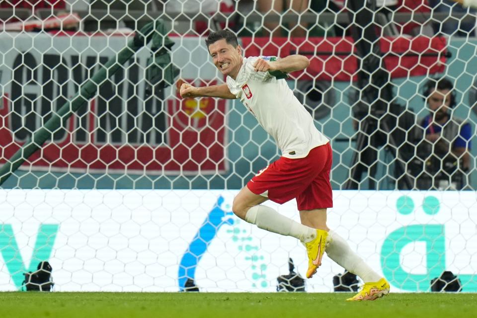 Poland's Robert Lewandowski celebrates after scoring his side's second goal during the World Cup group C football match between Poland and Saudi Arabia, at the Education City Stadium in Al Rayyan, Qatar, Saturday, Nov. 26, 2022. (AP Photo/Francisco Seco)