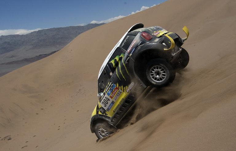 Mini's driver Nani Joan Roma of Spain and co-driver Michel Perin of France compete during the Stage 11 of the Dakar 2014 between Antofagasta and El Salvador, on January 16, 2014