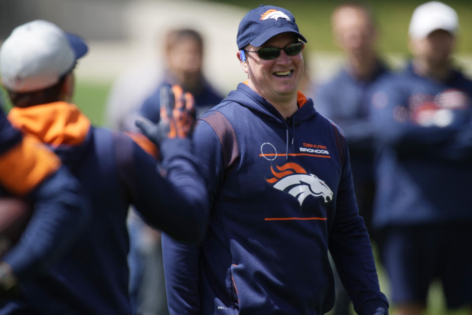 Denver Broncos head coach Nathaniel Hackett jokes with fellow coaches as players take part in drills during a voluntary veteran minicamp football practice Monday, April 25, 2022, at the NFL team's headquarters in Englewood, Colo. (AP Photo/David Zalubowski)