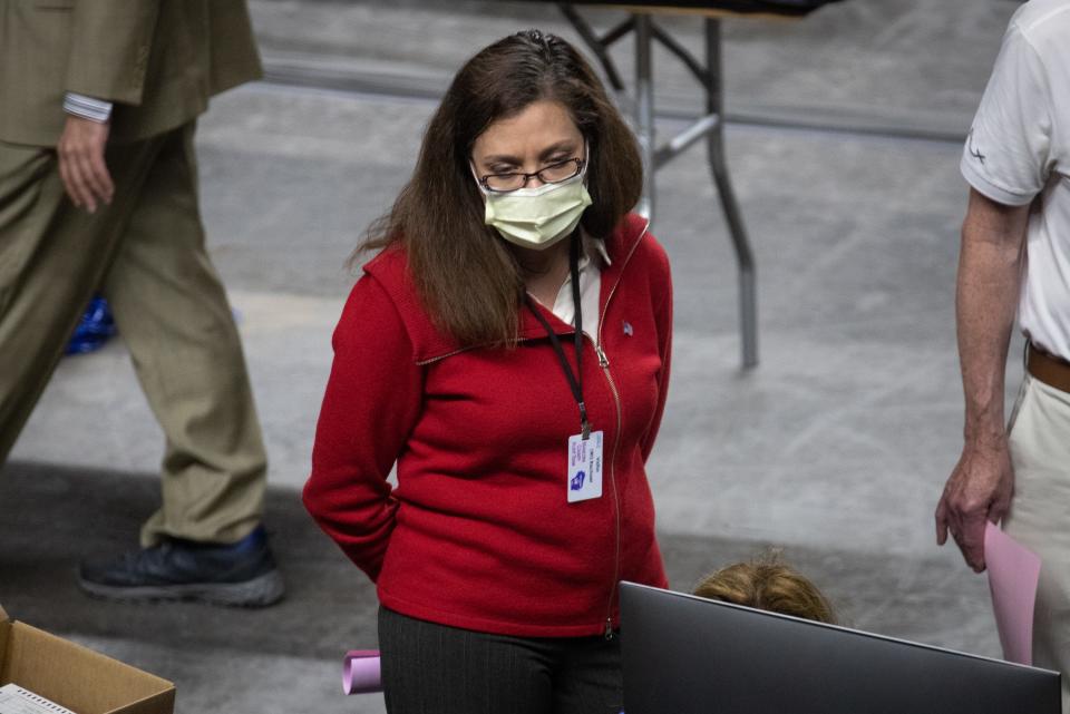 Wisconsin state Rep. Rachael Cabral-Guevara watches as Maricopa County ballots from the 2020 general election are examined and recounted by contractors hired by the Arizona Senate on June 12, 2021, at Veterans Memorial Coliseum in Phoenix, Arizona.