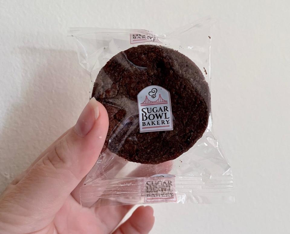 Writer holding a packaged brownie bite