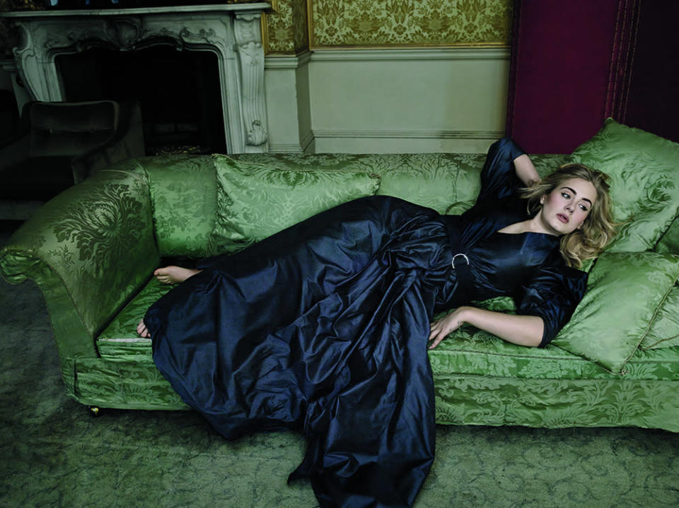 Adele wearing an Alexander McQueen gown in a photo shoot for March “Vogue.”