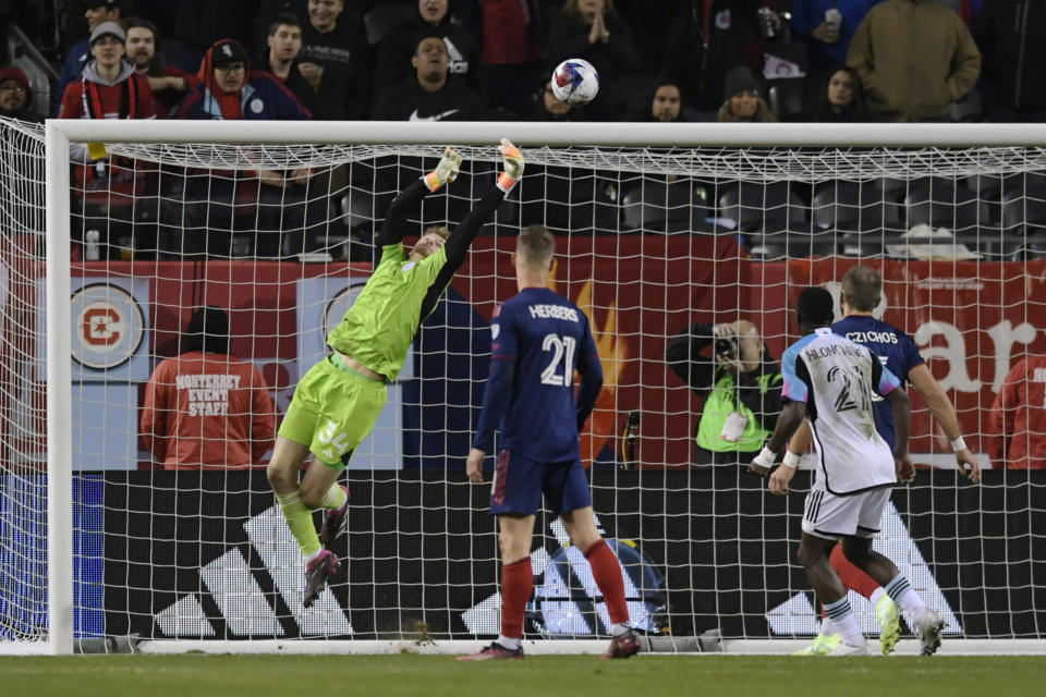 Chicago Fire goalie Chris Brady makes a save against Minnesota United during the second half of an MLS soccer match Saturday, April 8, 2023, in Chicago. Chicago won 2-1. AP Photo/Paul Beaty)