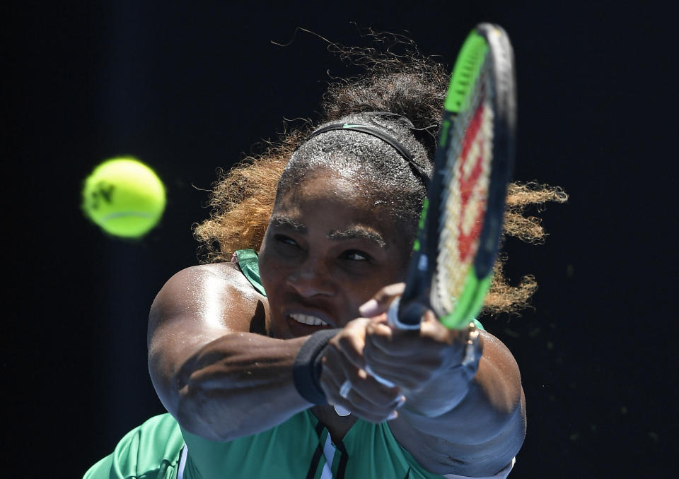 United States' Serena Williams makes a backhand return to Karolina Pliskova of the Czech Republic during their quarterfinal match at the Australian Open tennis championships in Melbourne, Australia, Wednesday, Jan. 23, 2019. (AP Photo/Andy Brownbill)