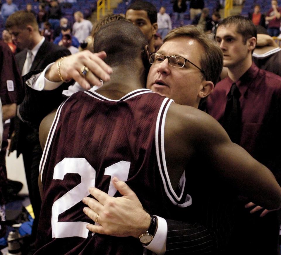 Southwest Missouri State's head coach Barry Hinson consoles Deke Thompson after losing to Creighton in the  Missouri Valley Conference tournament championship game Monday, March 7, 2005 in St. Louis. Creighton beat Southwest Missouri State 75-57 to advance to the NCAA Tournament.