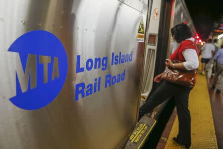 People board a Long Island Rail Road train at Pennsylvania Station in New York July 14, 2014. REUTERS/Shannon Stapleton