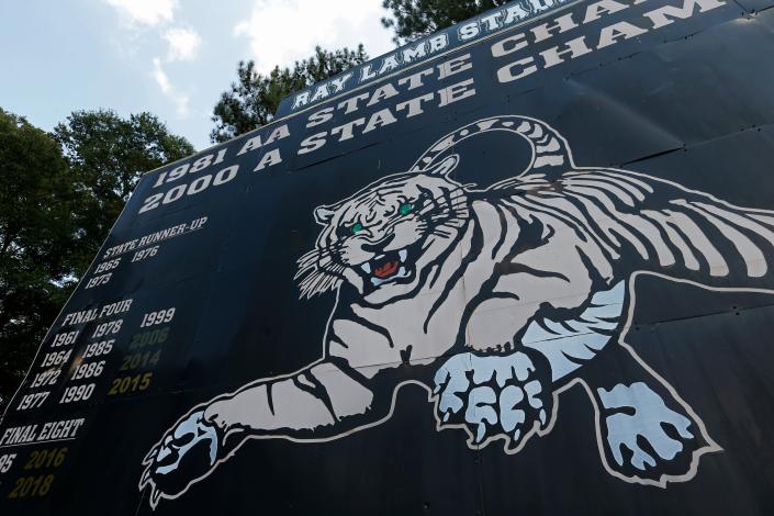 The Commerce scoreboard shows the history and success of the Tigers' football program.