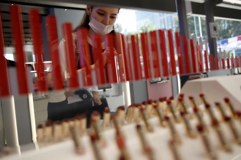 A customer wearing a face mask shops at a Chinese cosmetics brand Perfect Diary store, following the coronavirus disease (COVID-19) outbreak in Beijing