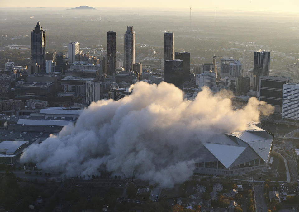 <p>The Georgia Dome is destroyed in a scheduled implosion next to its replacement the Mercedes-Benz Stadium, right, Monday, Nov. 20, 2017, in Atlanta. The dome was not only the former home of the Atlanta Falcons but also the site of two Super Bowls, 1996 Olympics Games events and NCAA basketball tournaments among other major events. (Curtis Compton/Atlanta Journal-Constitution via AP) </p>