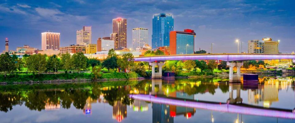 Little Rock, Arkansas, USA skyline on the Arkansas River at dusk.