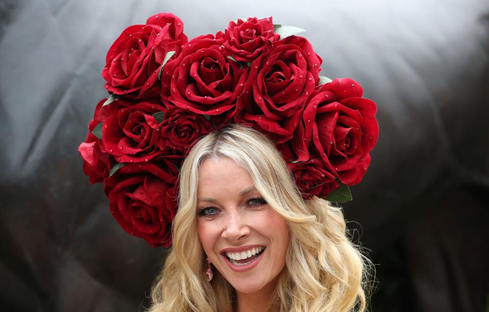 Roses are the focal point of this tall headpiece from the first day.