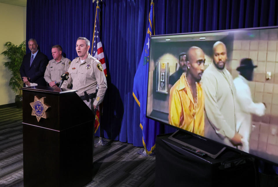  An image on a television monitor shows Tupac Shakur, left, and Marion 