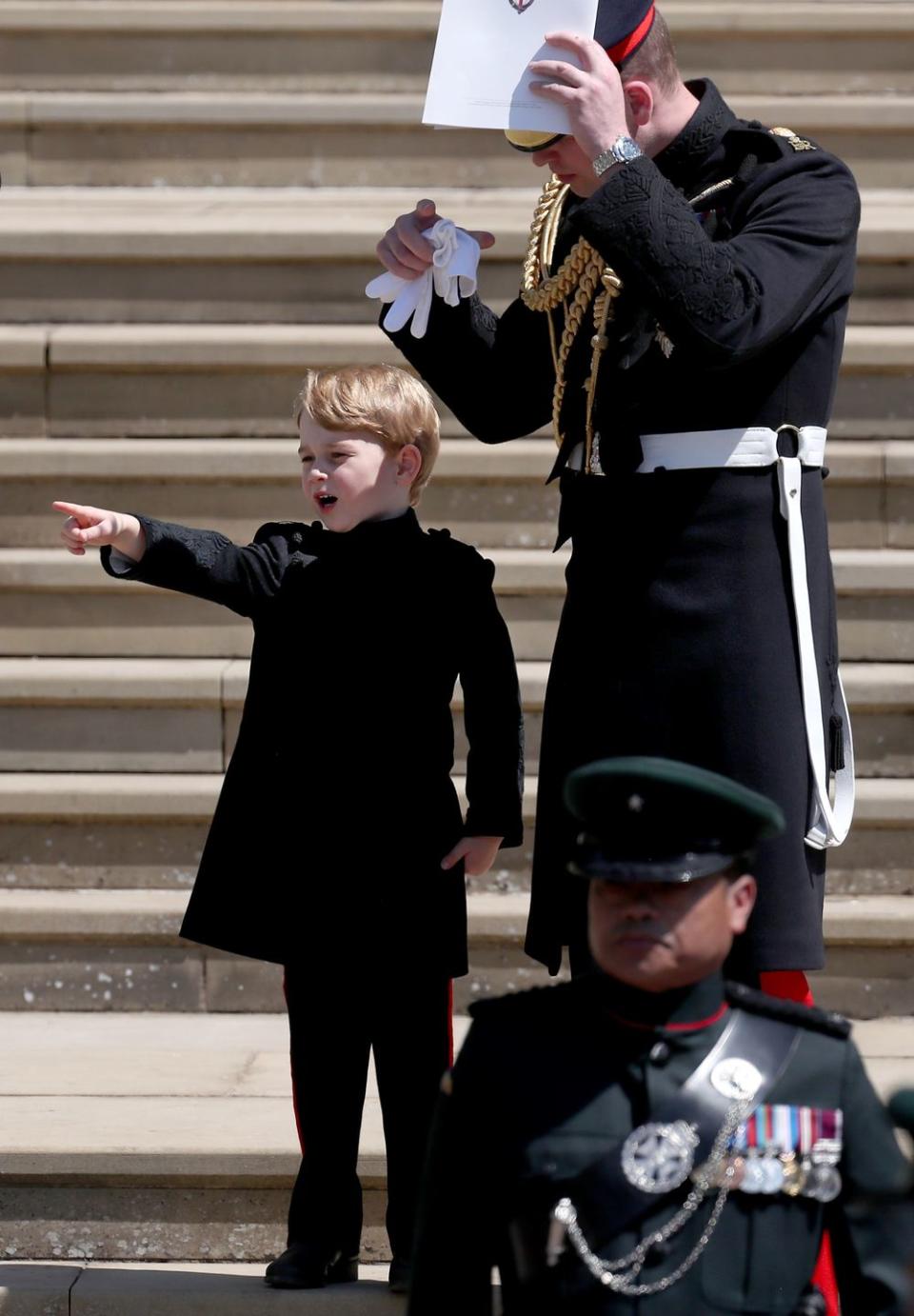 <p>Prince George excitingly points to show something to his father Prince William outside of St. George's Chapel at Windsor Castle after the wedding of <a href="https://www.cosmopolitan.com/entertainment/g20760206/royal-wedding-secrets/" rel="nofollow noopener" target="_blank" data-ylk="slk:Prince Harry and Meghan Markle in May 2018;elm:context_link;itc:0;sec:content-canvas" class="link ">Prince Harry and Meghan Markle in May 2018</a>. The best part? They’re wearing matching pants! Too cute.</p>