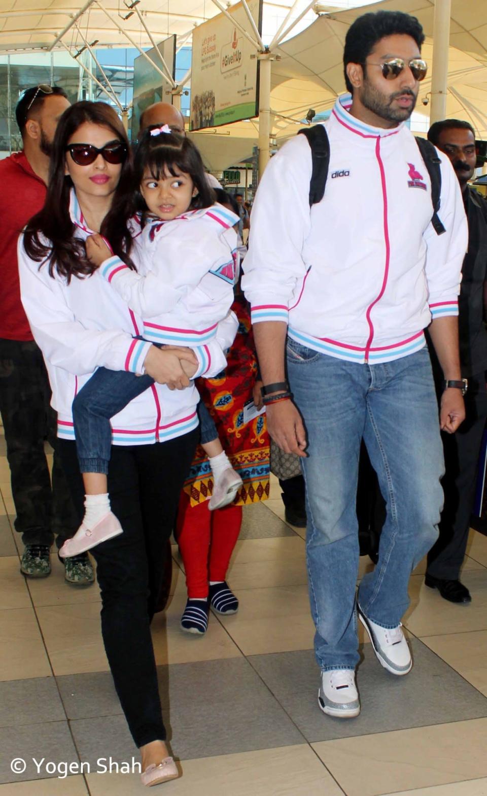 Aaradhya and her parents wore similar jackets, bearing the name of Jaipur Pink Panthers, as they flew back to Mumbai after the match.