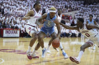 CORRECTS CITY TO BLOOMINGTON, INSTEAD OF INDIANAPOLIS - North Carolina forward Armando Bacot (5) is pressured by Indiana guard Xavier Johnson (0) and forward Malik Reneau, left, during the first half of an NCAA college basketball game in Bloomington, Ind., Wednesday, Nov. 30, 2022. (AP Photo/Darron Cummings)