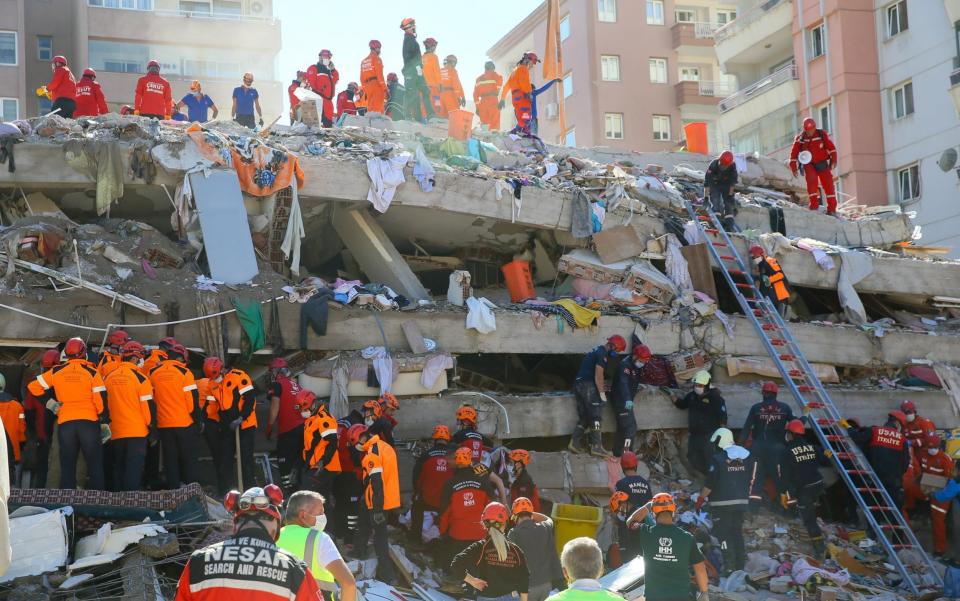 Search and rescue works continue at the rubbles of collapsed Riza Bey building located in Bayrakli district  - Anadolu