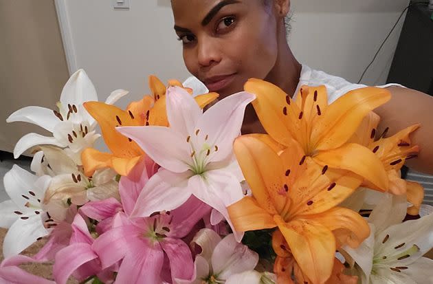 The author with flowers that her boyfriend got her for 