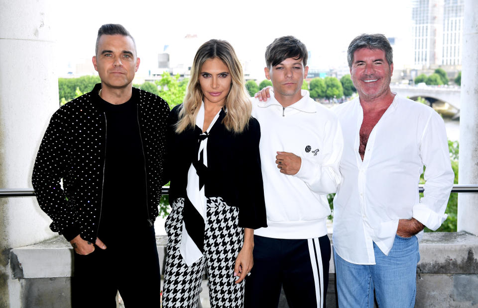 Last year’s X Factor judging panel, Robbie Williams, Ayda Field, Louis Tomlinson and Simon Cowell (Ian West/PA)