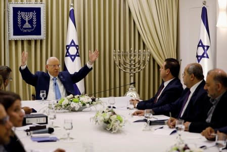 FILE PHOTO: Memebers of the United List party sits next to Israeli President Reuven Rivlin as he began talks with political parties over who should form a new government, at his residence in Jerusalem
