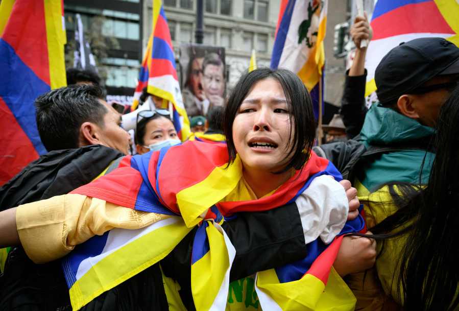 Pro-Tibet protesters confront supporters of Chinese President Xi Jinping during demonstrations on November 15, 2023. (Photo by JOSH EDELSON/AFP via Getty Images)